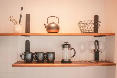 a shelf with wine glasses and a blender on it at Ananta Forest - Sunset & Gulf View - Glamping Dome and Mountain House in Monteverde Costa Rica