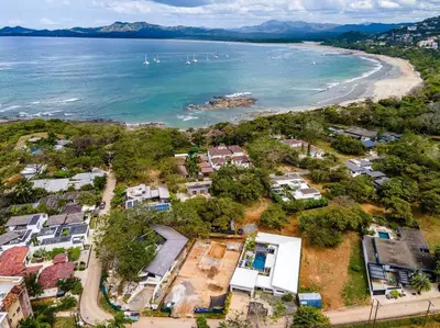 an aerial view of a beach with houses and the ocean at Private Pool with swim up bar and TWO Beaches in Tamarindo