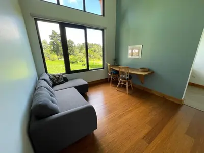 a living room with a couch and a table at Aires de Quetzales in Concepción