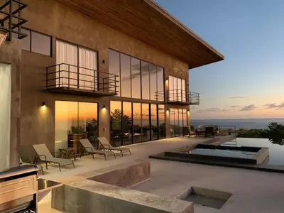 an exterior view of a house with a patio at Prime Hermosa- Ocean View Villa with Infinity Pool in Playa Hermosa