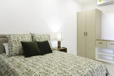 a bedroom with a large bed with a white at Prime Hermosa- Ocean View Villa with Infinity Pool in Playa Hermosa