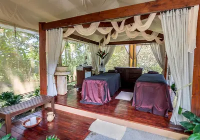 a bedroom with two beds in a tent at Hotel El Silencio del Campo in Fortuna