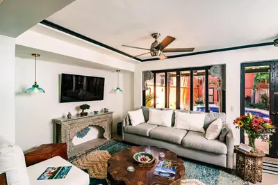 a living room with a couch and a fireplace at Luxury Villa With Beach Access and a Private Pool in Tamarindo