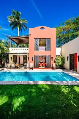 a house with a swimming pool in front of a house at Private pool BBQ, Fast Wifi Alarm Close to Beach in Tamarindo