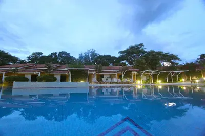 a large swimming pool in front of a resort at Seis Playas Hotel in Tamarindo