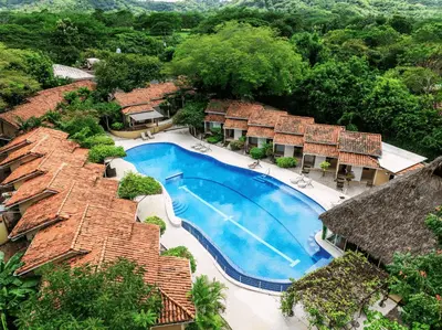 an aerial view of a resort with a swimming pool at Seis Playas Hotel in Tamarindo