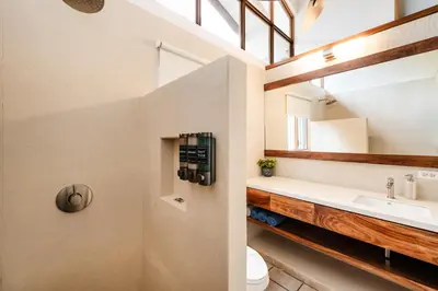 a bathroom with a sink and a toilet at Newly Remodeled Villa Across from the beach in Tamarindo