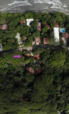 an aerial view of a house with trees and bushes at Newly Remodeled Villa Across from the beach in Tamarindo