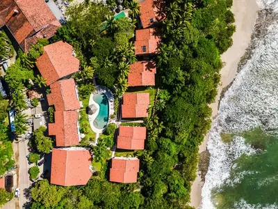 an overhead view of a group of houses on the beach at Beautiful 3 Bedroom Condo with Ocean Views in Tamarindo