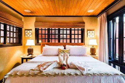 two women are laying on a bed in a bedroom at Luxury Villa, near the Beach with a Private Pool in Tamarindo