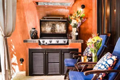 a kitchen with a stove top oven in a room at Luxury Villa, near the Beach with a Private Pool in Tamarindo