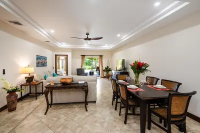 a living room with a couch and a table at Beachfront Easy Beach access, security & cameras in Tamarindo