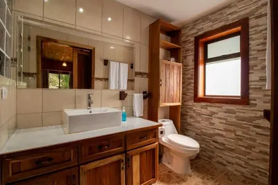 a bathroom with a sink and a toilet at Mountain Wonders Chalet in Monteverde Costa Rica