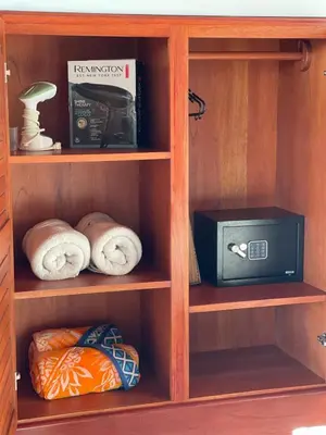 a book shelf with a microwave and a radio at Villa Del Mar 1 Spectacular ocean view! in Dominical