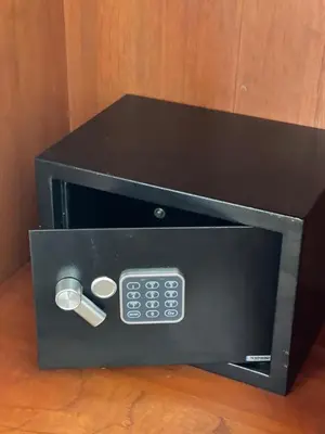a black microwave oven with a remote control at Villa Del Mar 1 Spectacular ocean view! in Dominical