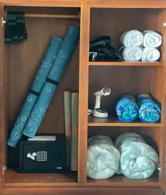 a wooden book shelf with plates and other items at Villa Del Mar 1 Spectacular ocean view! in Dominical