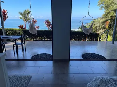 a balcony with a view of the ocean at Villa Del Mar 1 Spectacular ocean view! in Dominical