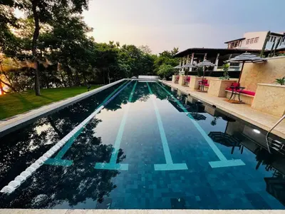 a large swimming pool with blue water at Beach, Oceanfront 2BR, 2BA Condo in Las Catalinas - Plaza Mercado 12 in Playa Danta