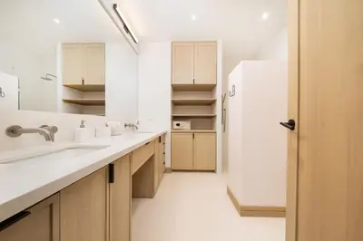 a white bathroom with a sink and a refrigerator at Beach, Oceanfront 2BR, 2BA Condo in Las Catalinas - Plaza Mercado 12 in Playa Danta