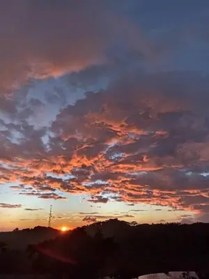 a sunset with clouds in the sky at Casa Típica La Cruz in Monteverde Costa Rica