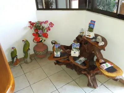 a room with two tables with products on them at Cadillac Rock Beach Hotel in Jacó