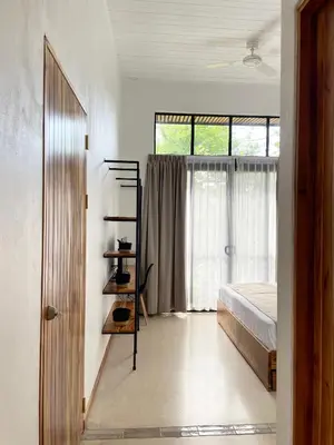 a bedroom with a bed and a window at Mar Botánico - Avellanas Beach Hotel in Playa Avellana