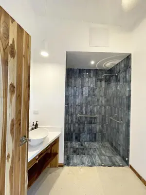 a bathroom with a sink and a shower at Mar Botánico - Avellanas Beach Hotel in Playa Avellana