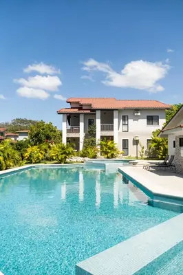 a swimming pool in front of a building at Nikla's - Villaggio 6 in Potrero