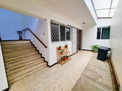 a staircase in a home with a stair case at Sabana Studios in San José