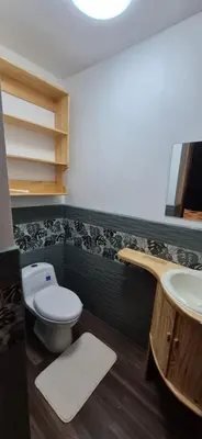 a bathroom with a toilet and a sink at Sabana Studios in San José