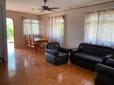 a living room with a couch and chairs and a table at Casas La Chirincoca in San Isidro
