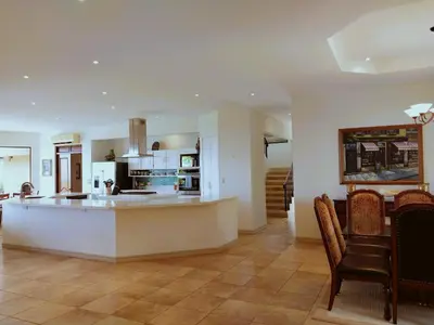 a large kitchen with a large island in a room at Casa Sol Azul - remarkable, ocean view 4 BR House in Potrero in Potrero