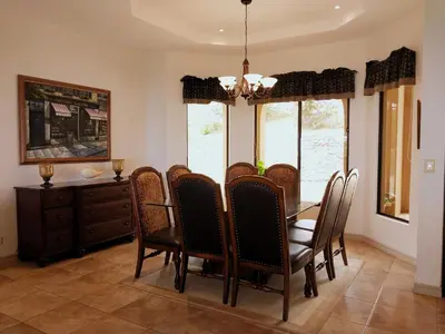 a dining room with a table and chairs at Casa Sol Azul - remarkable, ocean view 4 BR House in Potrero in Potrero