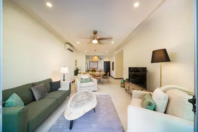 a living room with a couch and a table at Condo Casa Blanca 6 - modern 2BR,2BA near to Beach & Town in Potrero