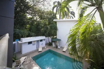 a swimming pool in the backyard of a house at Condo Casa Blanca 6 - modern 2BR,2BA near to Beach & Town in Potrero