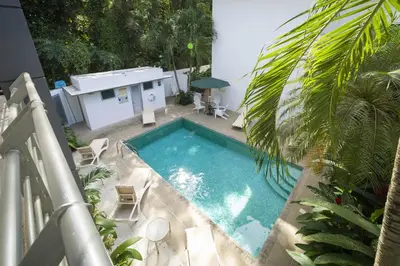 a view of a swimming pool from a balcony at Condo Casa Blanca 6 - modern 2BR,2BA near to Beach & Town in Potrero