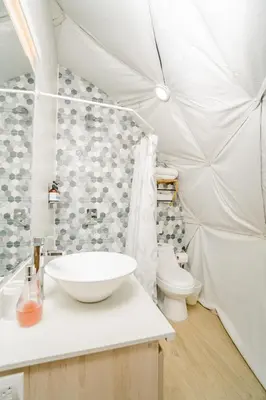 a bathroom with a sink and a toilet at Glamping Tortuga Verde in Ocotal