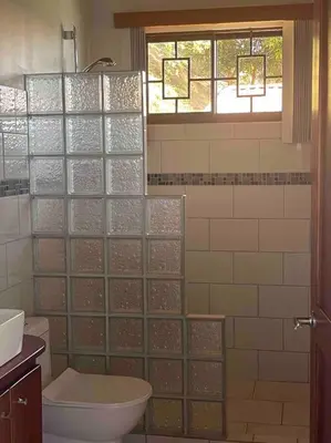 a bathroom with a glass walled shower with a toilet at Villa Del Mar 2 Spectacular ocean view! in Dominical