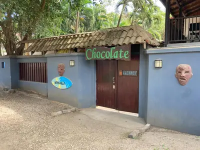 a blue building with a sign that reads chocolate at Chocolate in Tamarindo