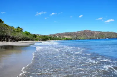 a view of the beach from the shore at Hotel El Velero in Playa Hermosa
