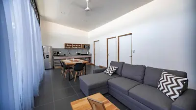 a living room with a couch and a table at Villa Tanager in Fortuna