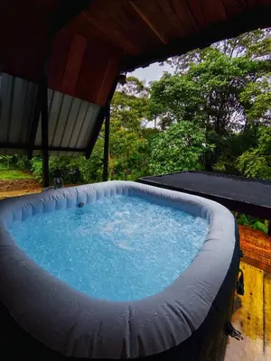 a hot tub in a backyard with a roof at Quinta Túru in Colonia