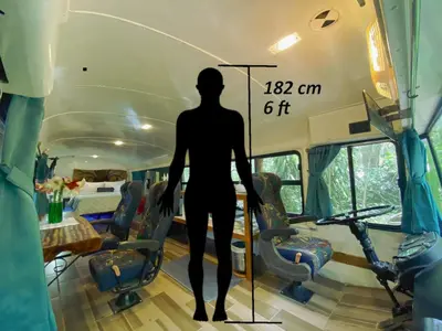 a man standing in the inside of a bus at Ficus Wonders Bus in Monteverde Costa Rica