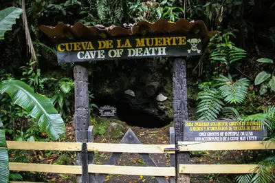 a sign for aucula de la muerte cave of death at Recreo Verde Hot Springs & Spa in Marsella