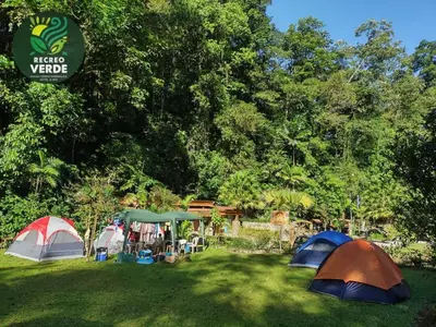 a group of tents in a field with trees at Recreo Verde Hot Springs & Spa in Marsella