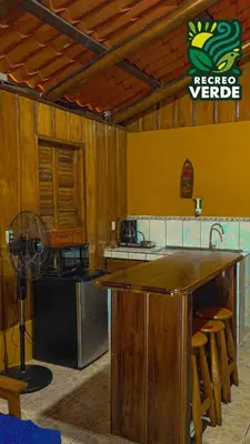 a kitchen with a counter and a stove top oven at Recreo Verde Hot Springs & Spa in Marsella