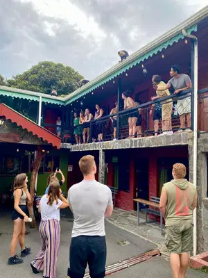 a group of people standing outside of a building at Manakin Lodge, Monteverde in Monteverde Costa Rica