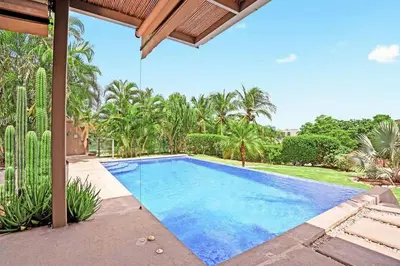 a swimming pool in the backyard of a villa at 8min Walk to Beach, Pool Villa, 24-7 Concierge in Tamarindo