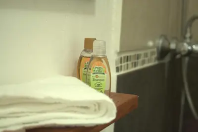 a bottle of cleaning agent sitting on top of a counter at Sol Pacifico Lodge in Cascajal