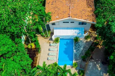 an overhead view of a house with a blue door at Casa Corona Del Mar Tamarindo in Tamarindo